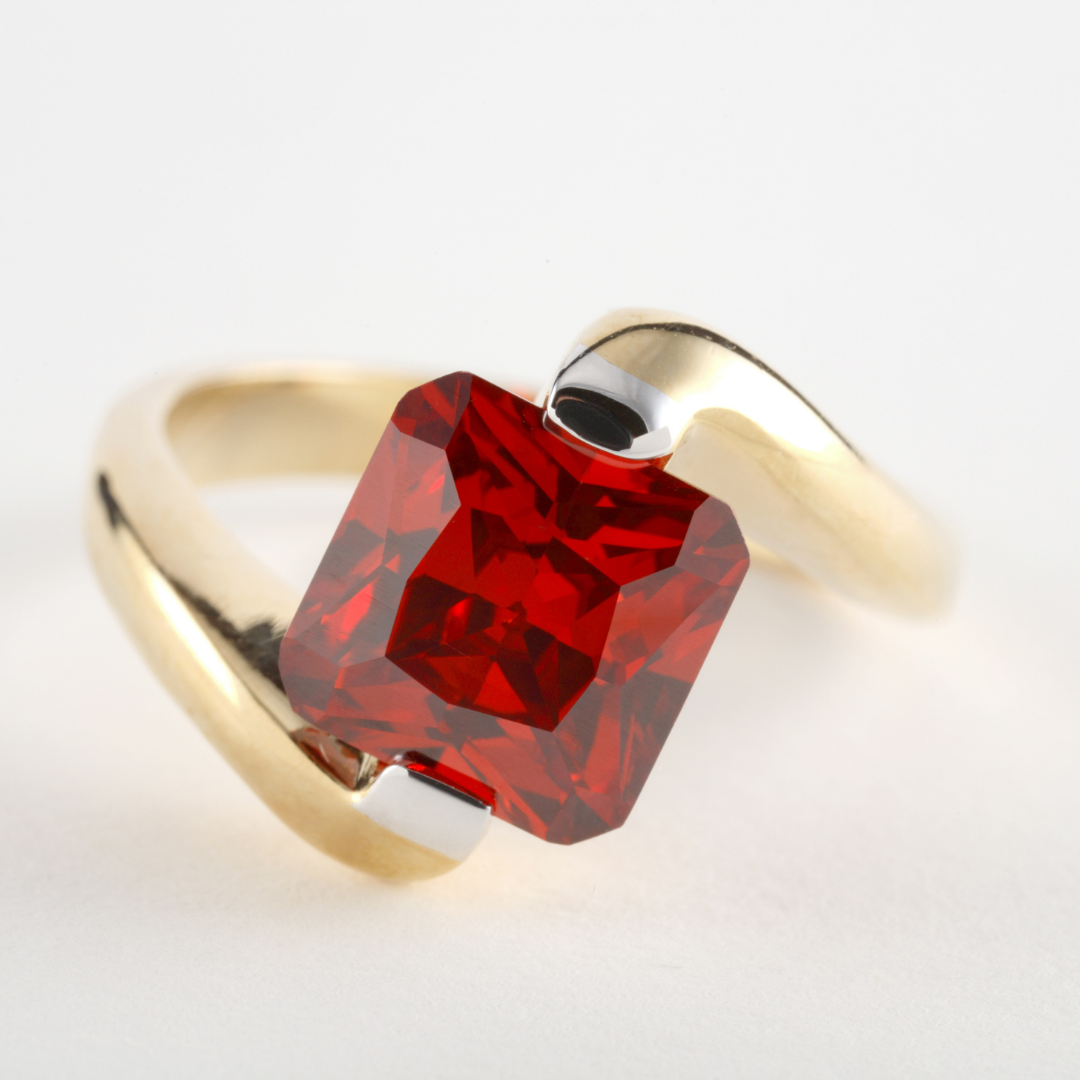 Red garnet ring set in yellow gold