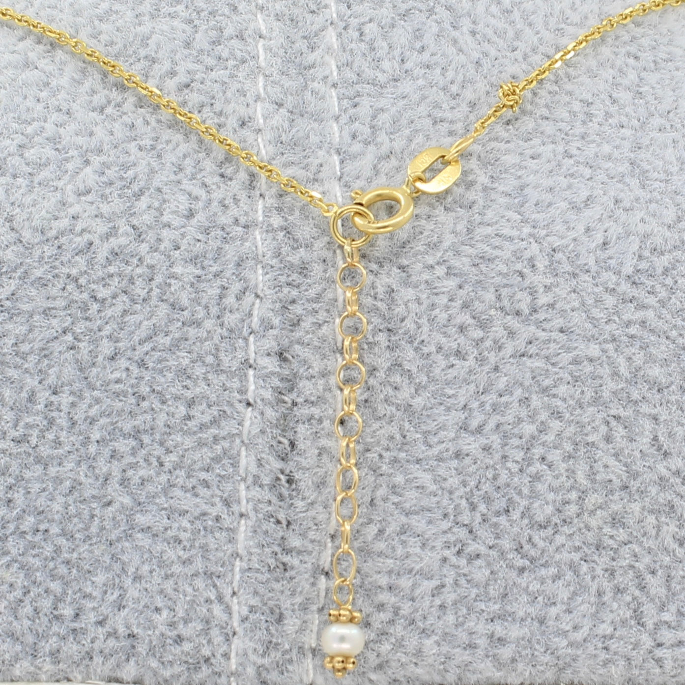 Backside of Peridot and pearl gold station necklace