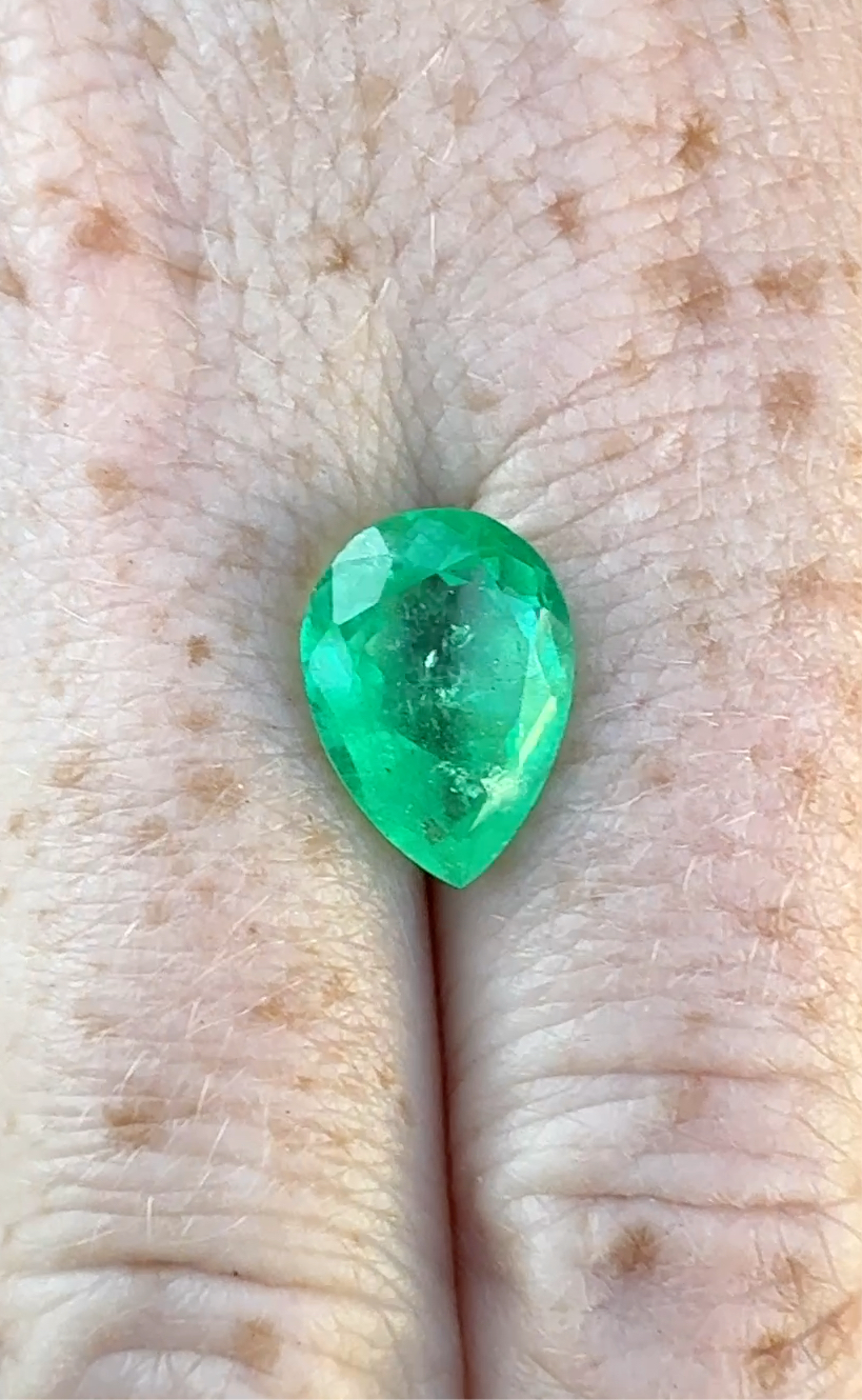 Columbian emerald GIA pear green F2 moderate oil in hand