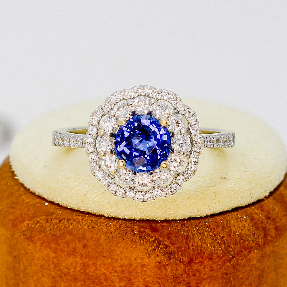 Cobalt blue spinel ring made of white gold with a diamond halo