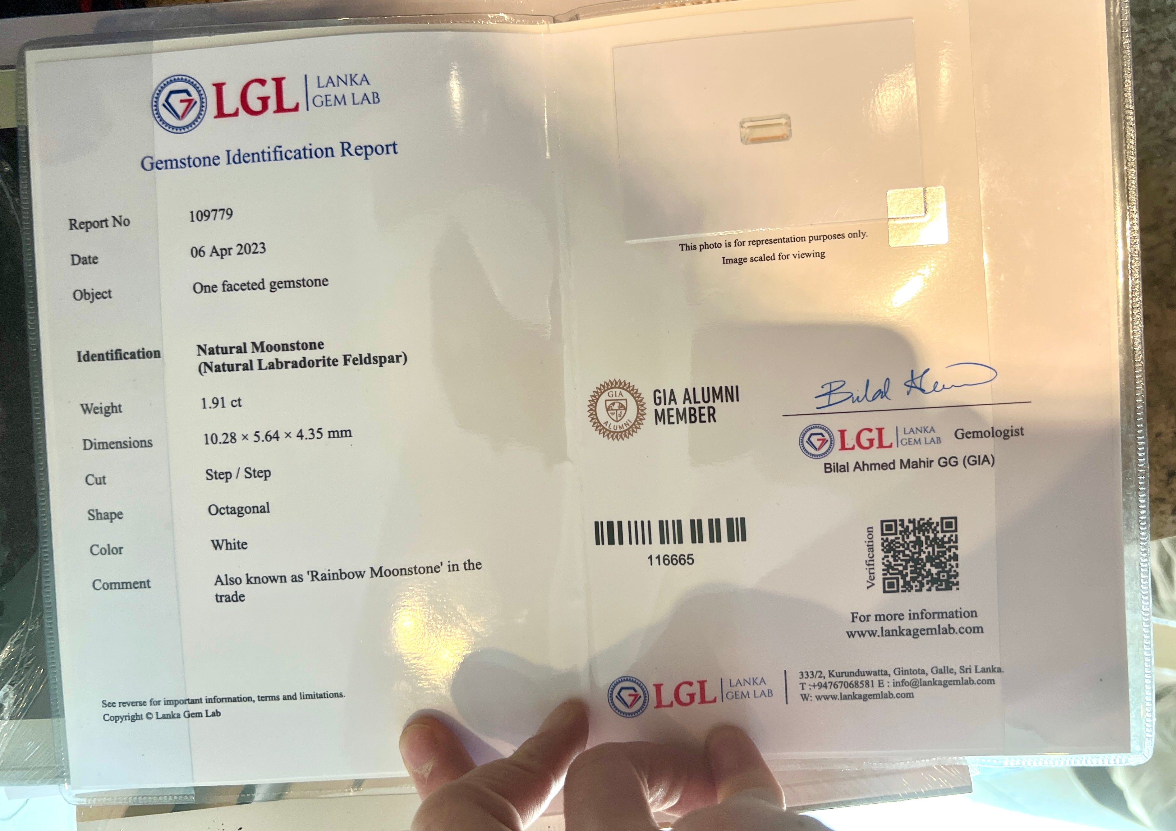 In person image of the rainbow moonstone lab certificate