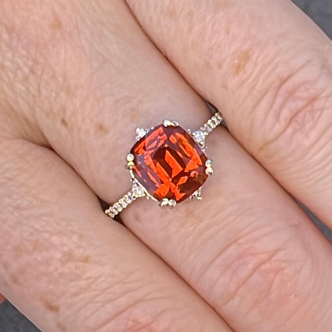 Spessartine garnet ring in natural light on finger