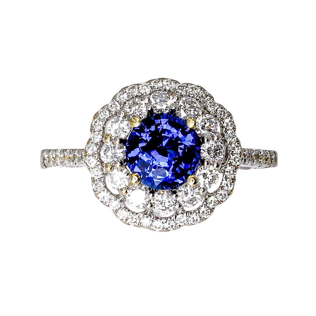 Blue tanzanian spinel with a diamond halo in 18k white gold