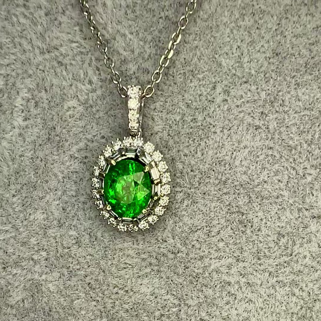 Tsavorite garnet pendant in white gold with a diamond halo