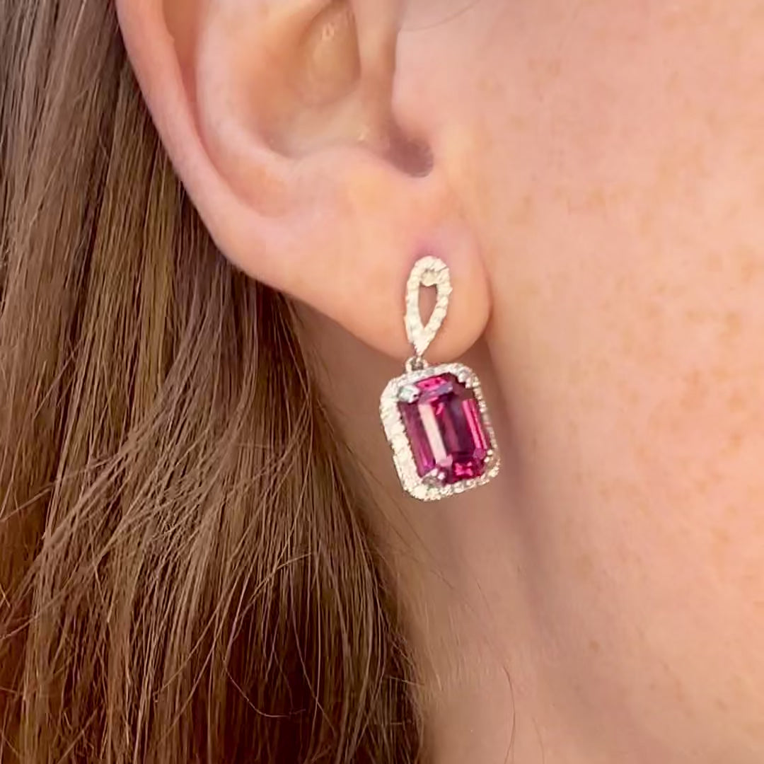 Mahenge Garnet Drop Earrings on the ear with a shake and display of color.