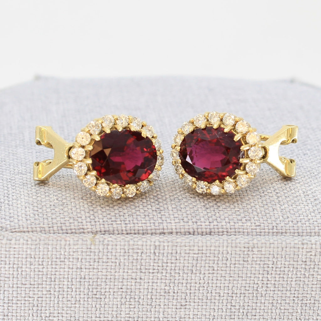 Deep red rubellite earrings in 14k yellow gold with posts and omega clips