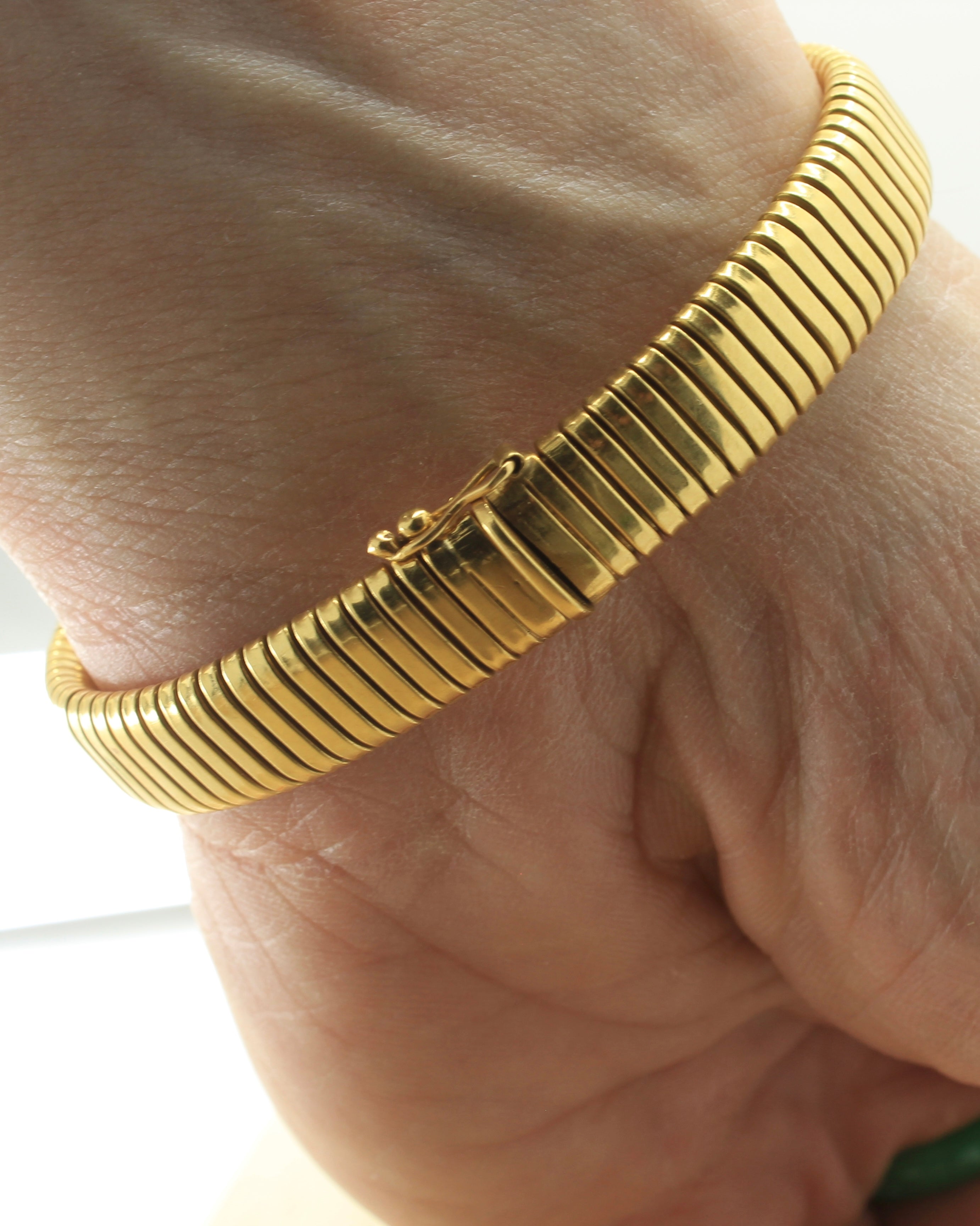 Tubogas bracelet made of 18K yellow gold on wrist