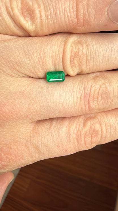 emerald from brazil on hand step cut deep green