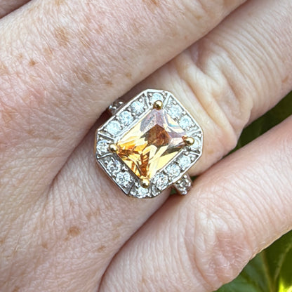 imperial topaz diamond and gold ring on hand natural light