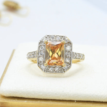 imperial topaz diamond and gold ring front view orange radiant cut