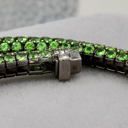 Tsavorite tennis bracelet box clasp 18k gold designer Martin Katz black gold green round