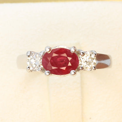 Three stone ruby ring with side diamonds set in white gold classic design