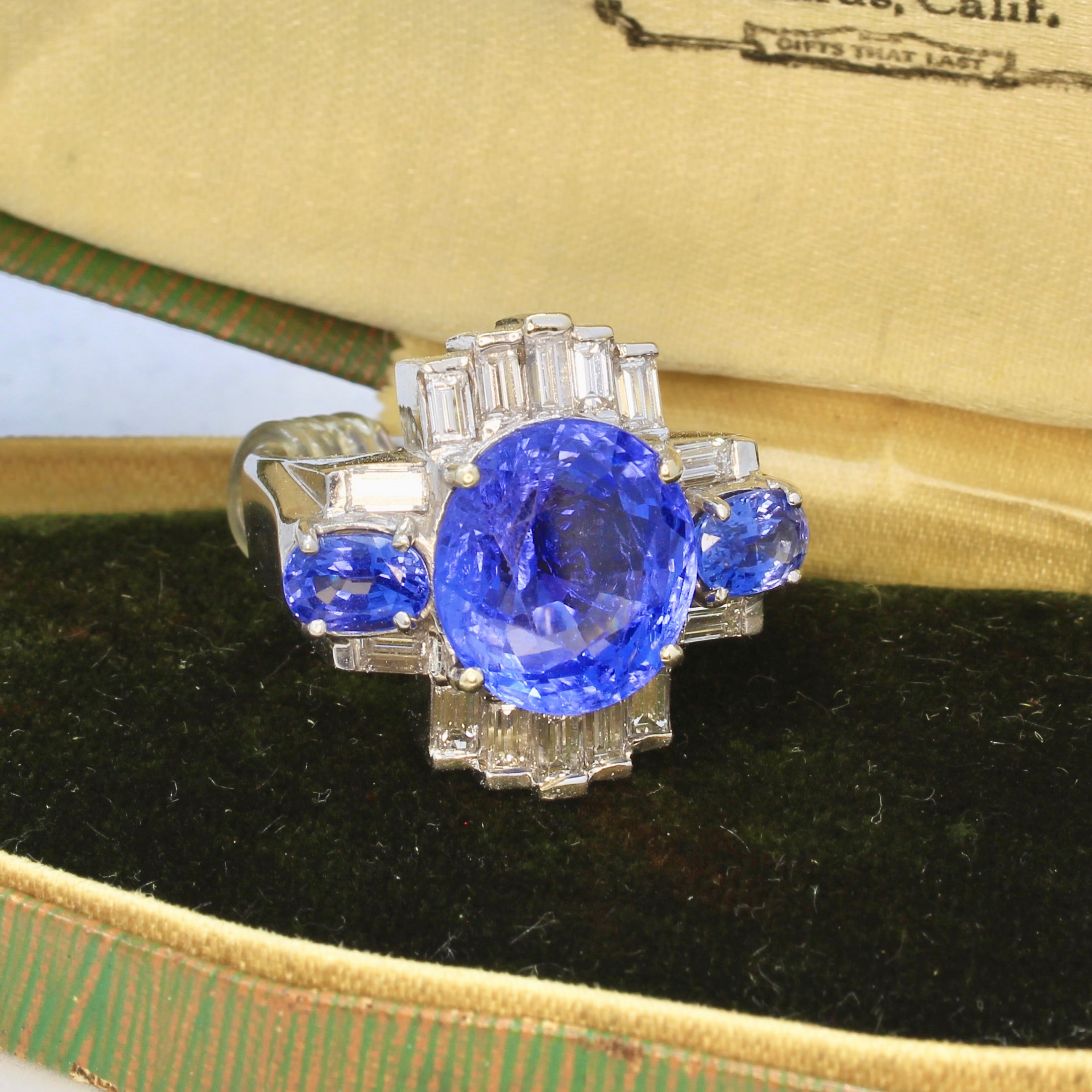 Art deco Ceylon sapphire no heat engagement ring in an antique jewelry box