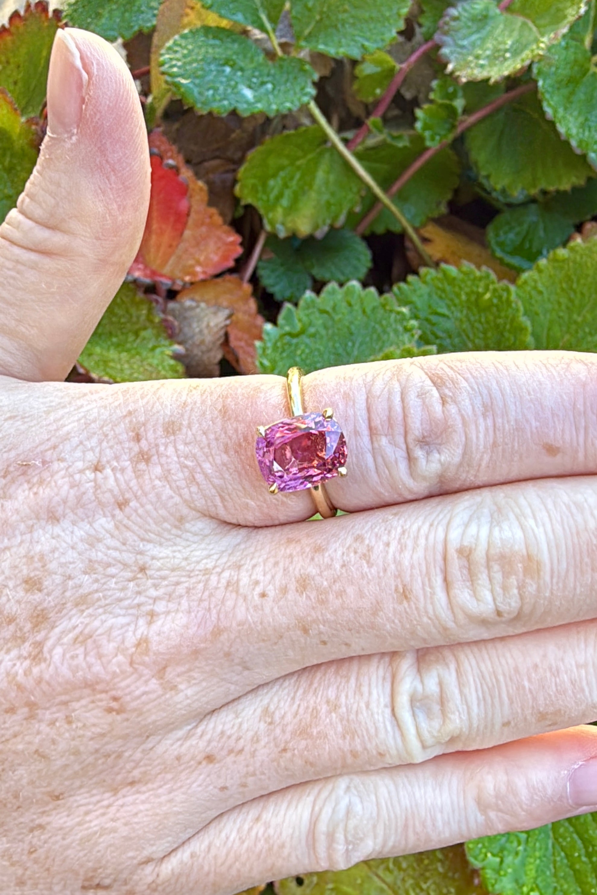 Pink spinel engagement ring natural light on hand solitaire AGL 