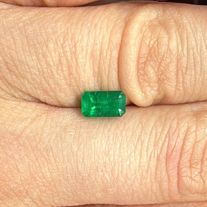 emerald from brazil on hand step cut deep green