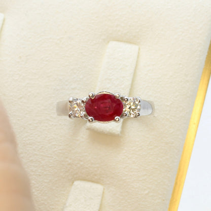 Three stone ruby ring with side diamonds set in white gold classic design