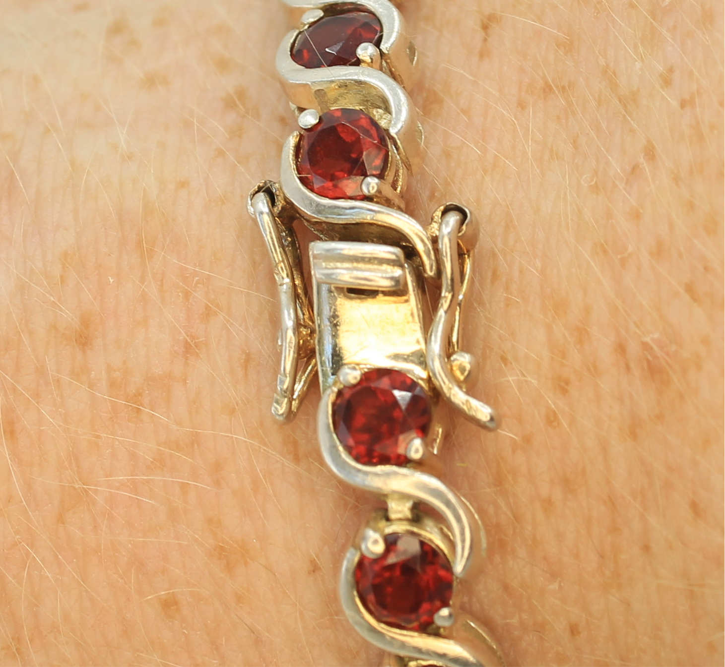 Double locking setup for the red garnet tennis bracelet