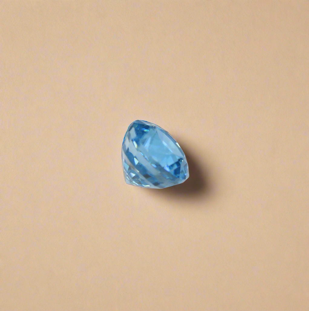Round blue zircon from the side