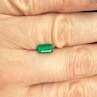 emerald from brazil on hand step cut deep green