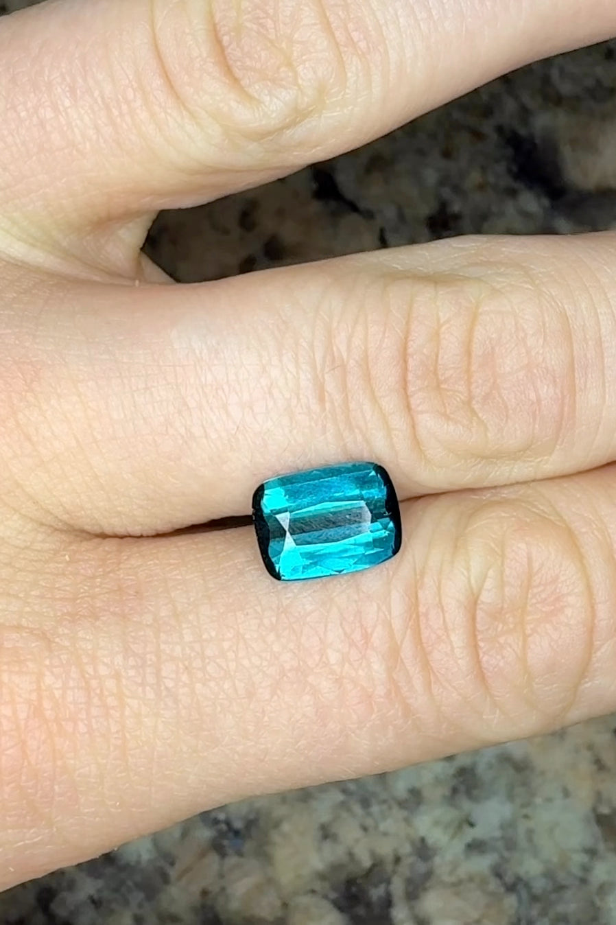 teal blue indicolite tourmaline cushion video on hand