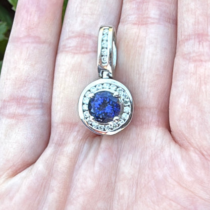 Tanzanite white gold pendant with diamonds and large bail in hand