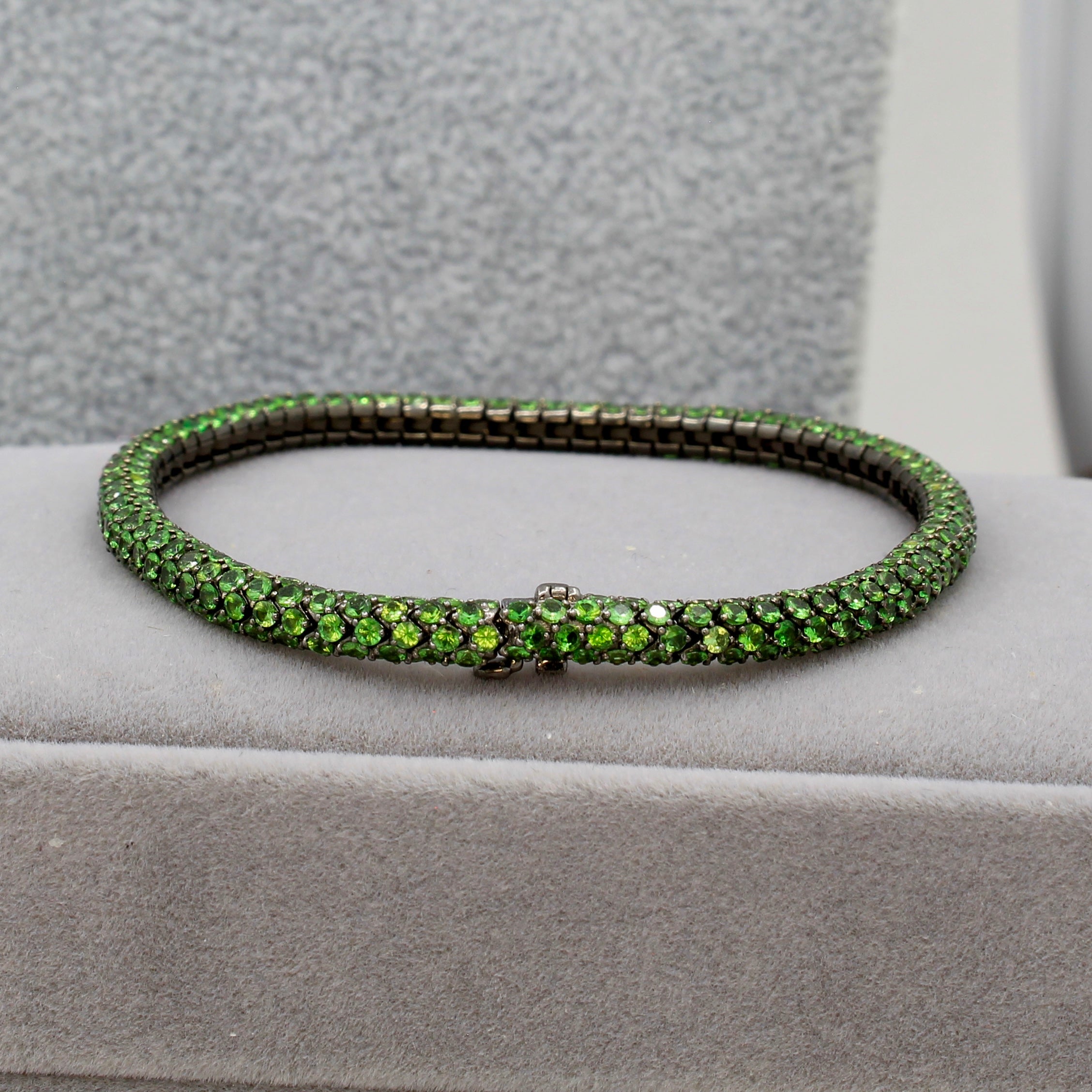 Tsavorite tennis bracelet 18k gold designer Martin Katz black gold green round