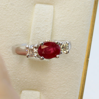 Three stone ruby ring with side diamonds set in white gold classic design