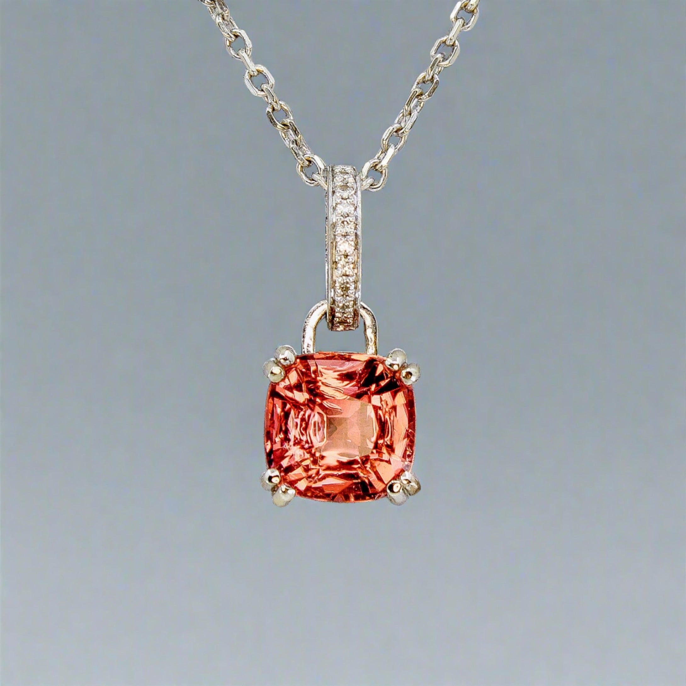 Pink tourmaline pendant in 14k white gold with diamond accent on the bail