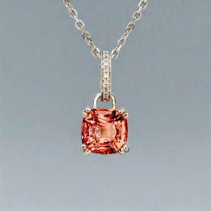 Pink tourmaline pendant in 14k white gold with diamond accent on the bail