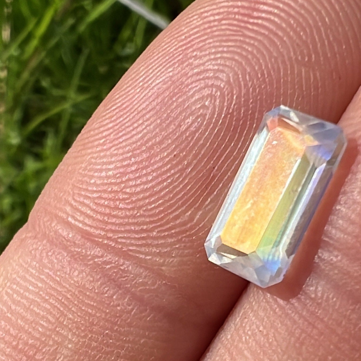 Rainbow moonstone showing some more green and blue along with the orange and yellow