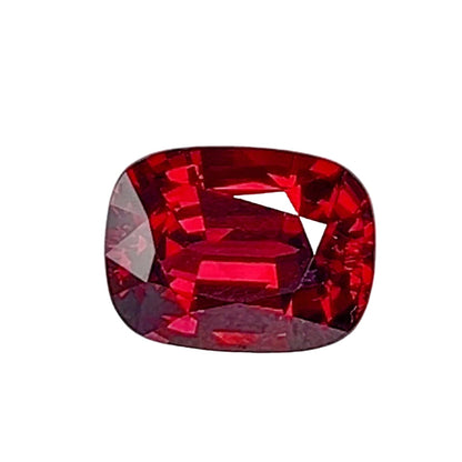 Loose Gemstone - Intense Red Rhodolite Garnet Cushion with a gray background