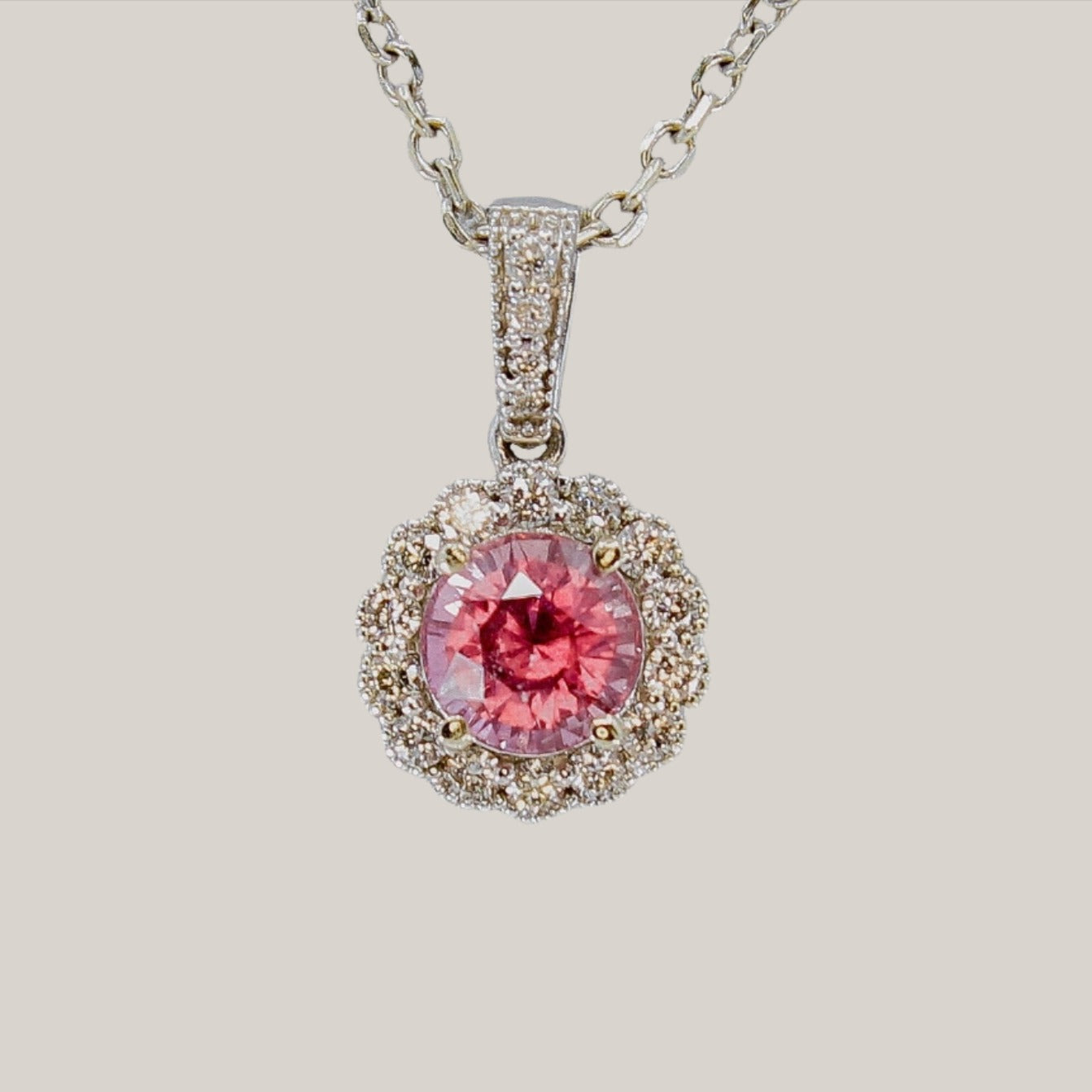 GIA certified Pink sapphire pendant in 14k white gold with natural diamond accent and halo