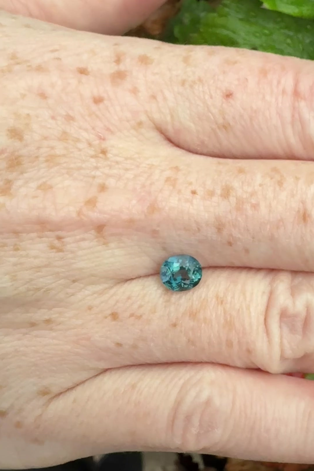 GIA sapphire teal oval no heat brilliant eye clean greenish blue on hand video