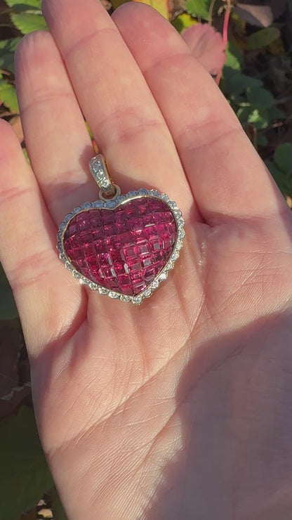 invisible set ruby heart pendant with a latching clasp and diamond accent.