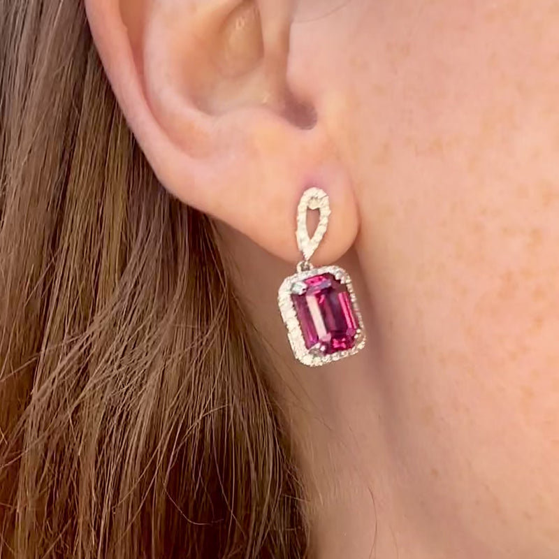 Mahenge Garnet Drop Earrings on the ear with a shake and display of color.