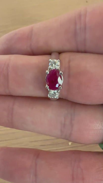 Three stone ruby ring with side diamonds set in white gold classic design video movement