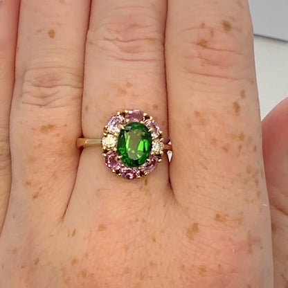 Vivid green tourmaline ring on hand. Made of 18K gold with hallmarks.