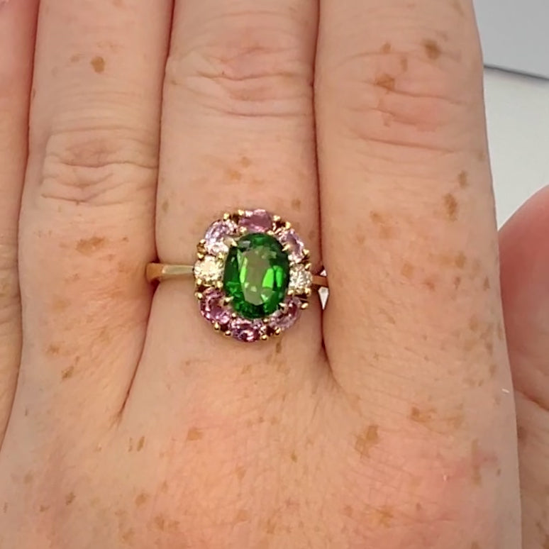 Vivid green tourmaline ring on hand. Made of 18K gold with hallmarks.